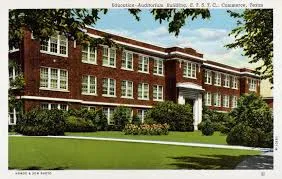 Vintage postcard of a two-storey red-brick school building with a lawn in front