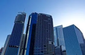 Glass-clad high-rise office towers against a blue sky