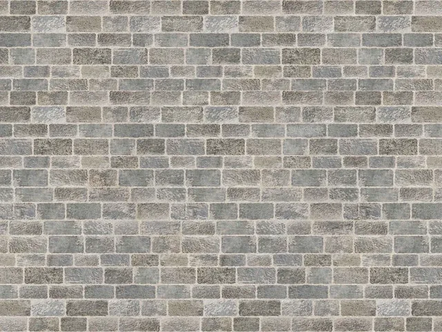 Grey brick wall laid in stretcher bond