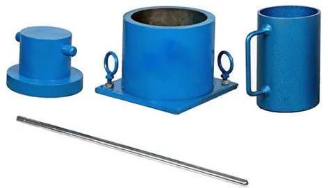 Aggregate crushing mould set: plunger, open-ended steel cylinder on a base plate, cylindrical measure and tamping rod