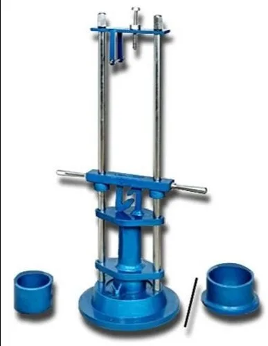 Blue aggregate impact testing machine with the hammer on vertical guide rods, two cylindrical cups and a tamping rod