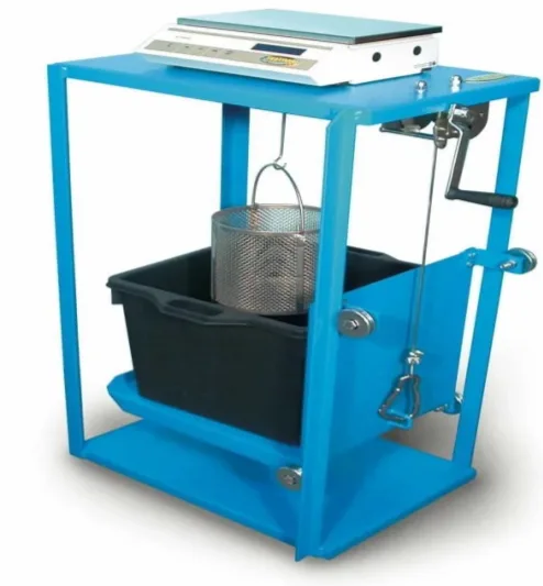 Blue frame with a digital balance on top and a wire basket hung from it into a black water container