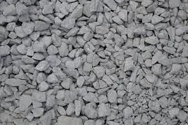 Heap of grey angular crushed stone aggregate