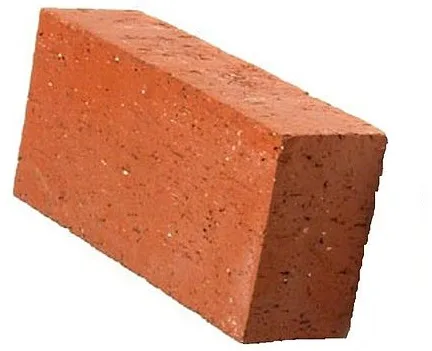 Single red clay brick shown at an angle against a white background