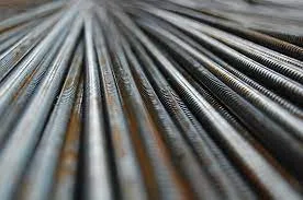 Close-up of ribbed steel reinforcing bars laid side by side