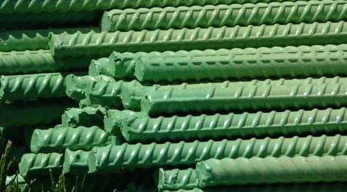 Stack of green epoxy-coated ribbed rebars